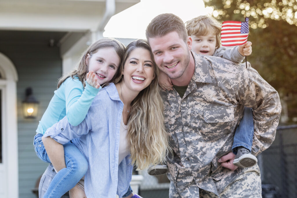 financial coach working with military family on debt plan